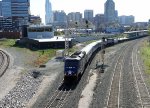 RNCX 1755 leads train P075-04 away from the station